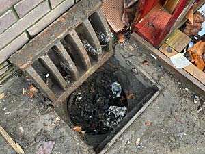 A full surface water gully - Wembley
