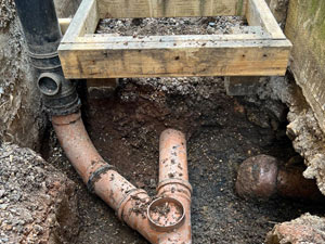 A Soil Stack Pipe Misconnected to a Surface Water Drainage System 