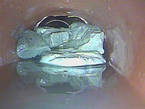 Concrete debris blocking drain Wembley