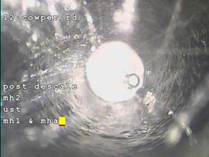 Drain jetting in action to remove attached encrustations