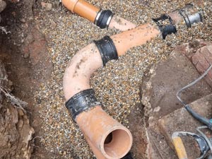 Re configuration of a drainage system within a property extension footprint.